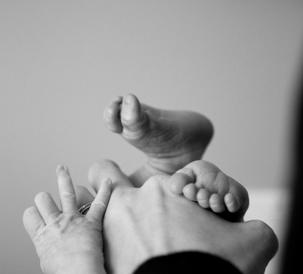 Baby feed and hands in mothers hands